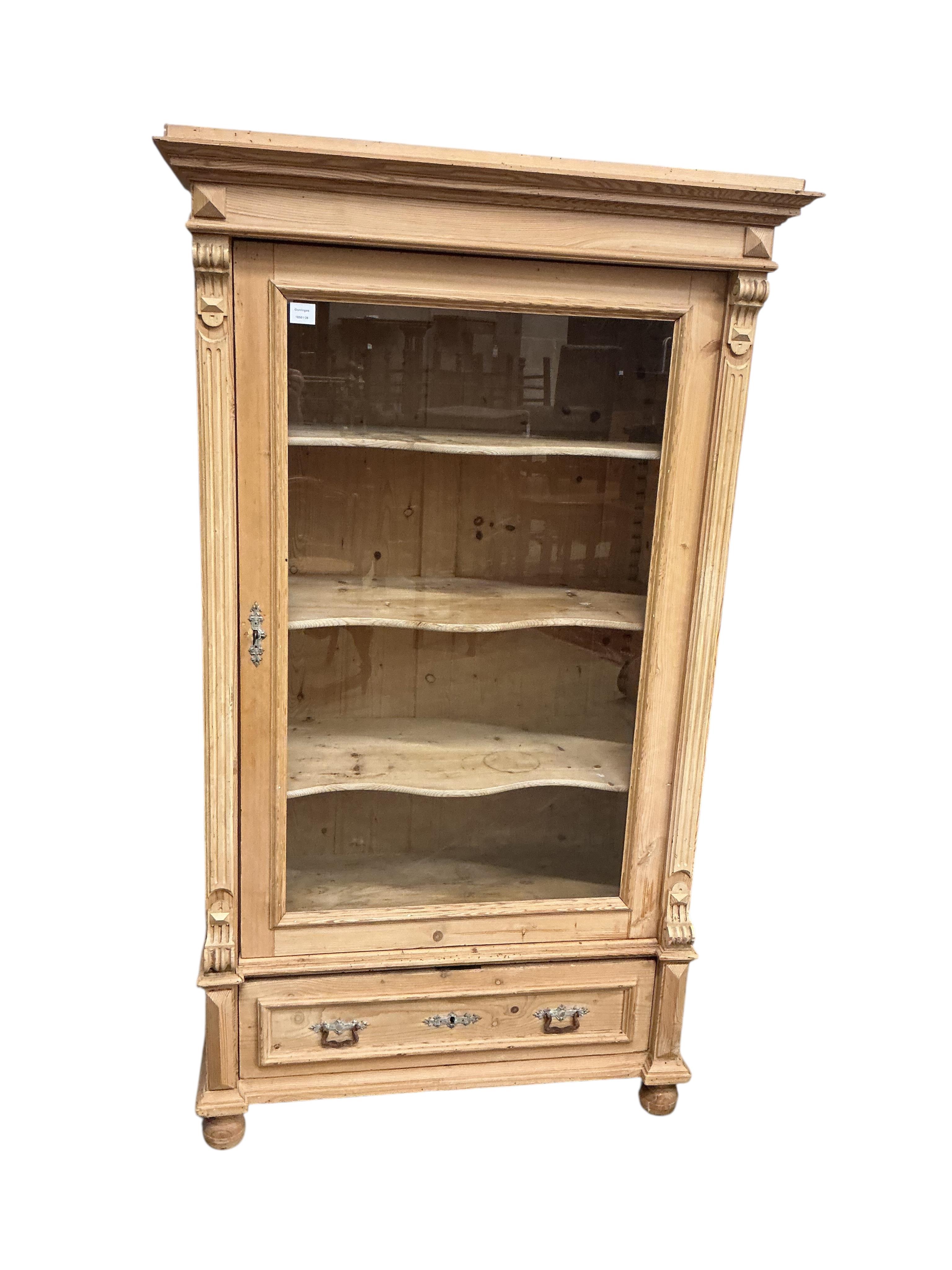 A 19th century East European glazed pine armoire, width 105cm, depth 56cm, height 182cm